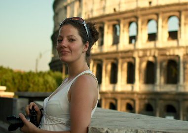 Daniela with her camera in front of the Colosseum in Rome, Italy